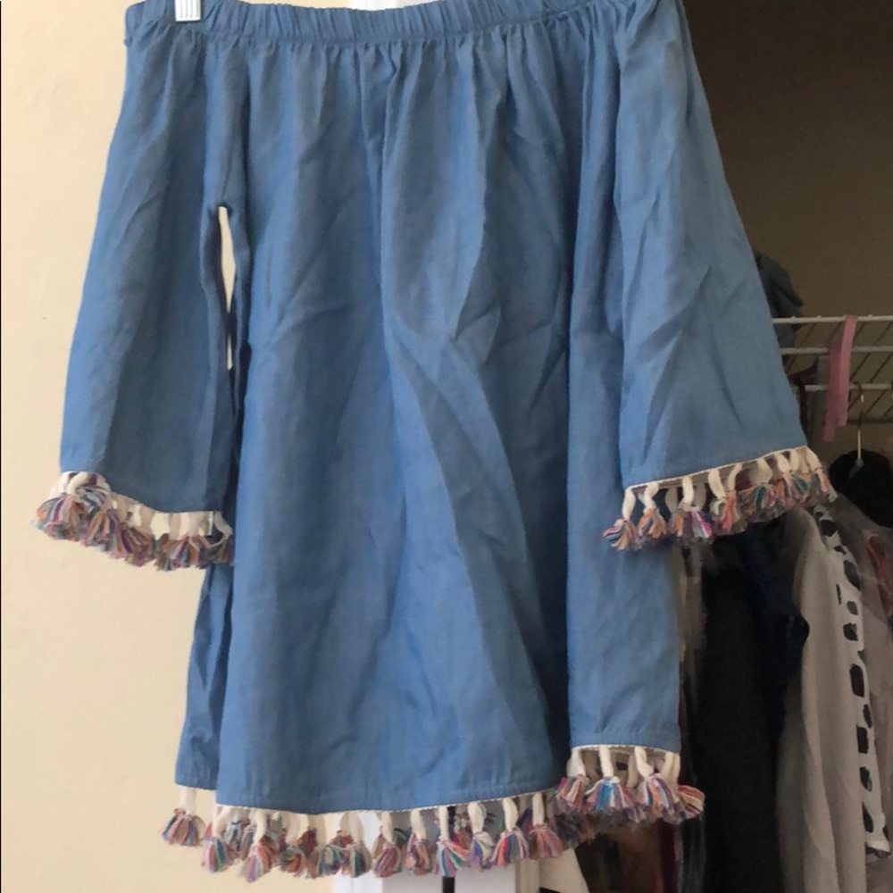 Off the should pom pom shirt